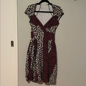 Pinup Couture      Leopard print dress. Fit and flare. VERY flattering!